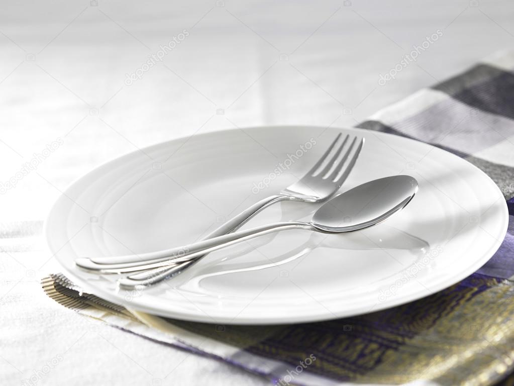 Fork and  spoon on plate