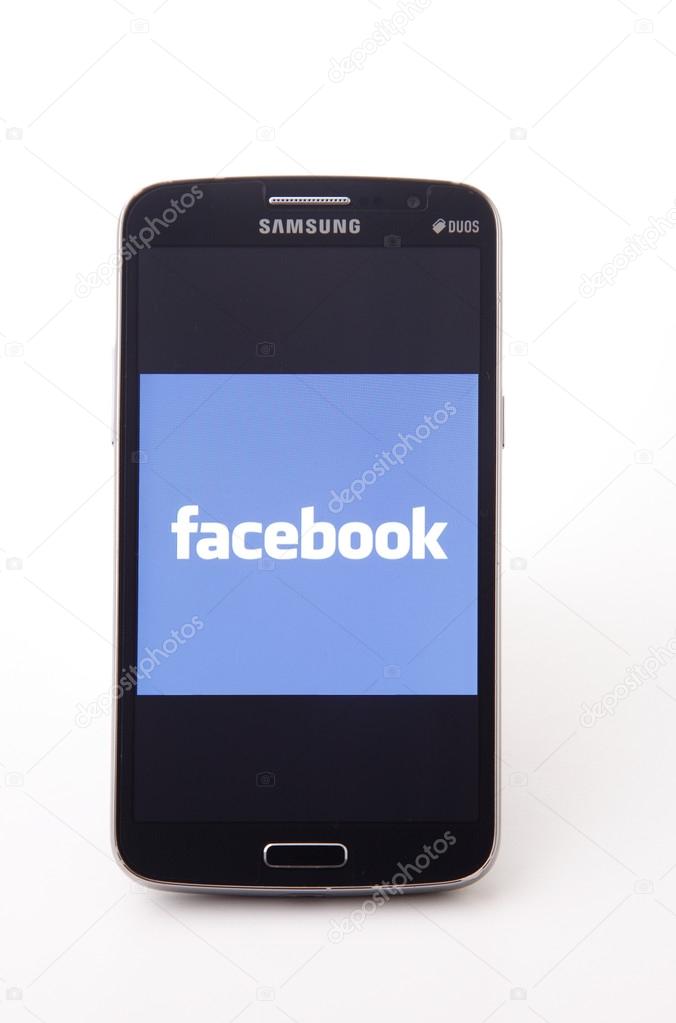 KUALA LUMPUR, MALAYSIA,  MAY 14, 2015: Facebook application logo on smart Phoneon white  background. Facebook is largest and most popular social networking site in the world
