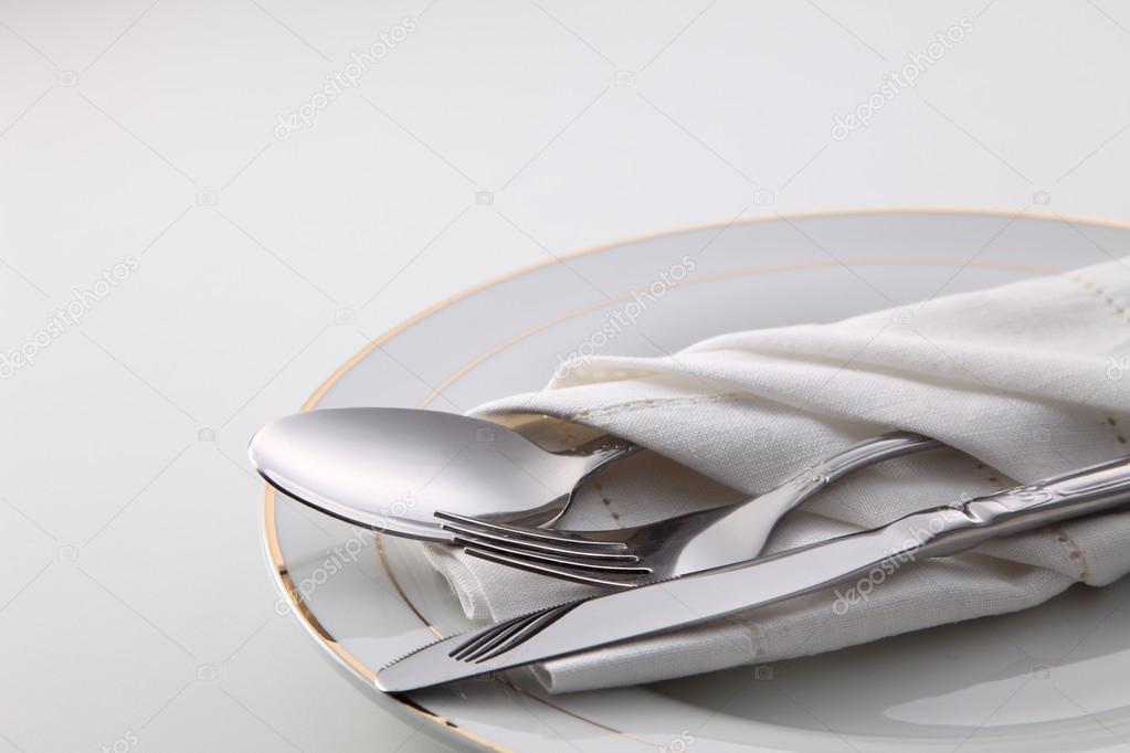 folded napkin with utensils