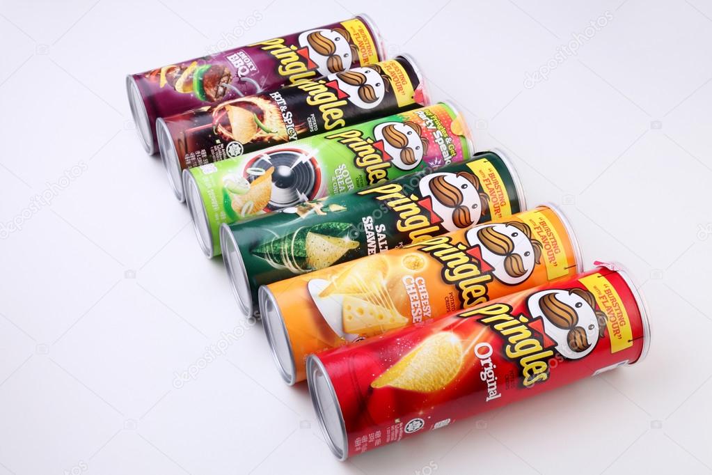 KUALA LUMPUR, MALAYSIA,  MAY 14, 2015:  Pringles chips packages  on white background. Owned by the Kellogg Company, Pringles is a brand of potato snack chips sold in 140 countries