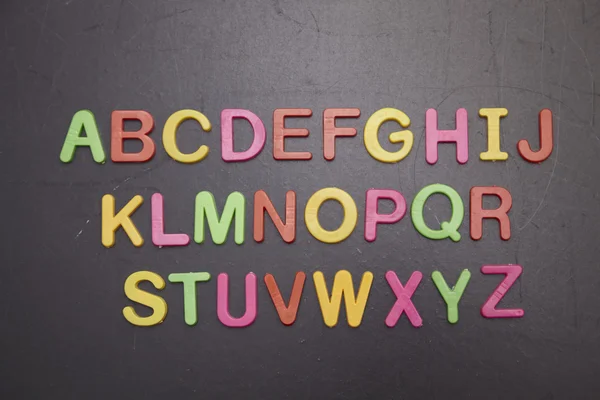 Kolorowy alfabet na tablicy — Zdjęcie stockowe