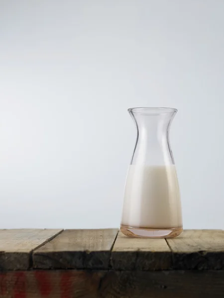 Fresh milk on wooden table — Stock Photo, Image