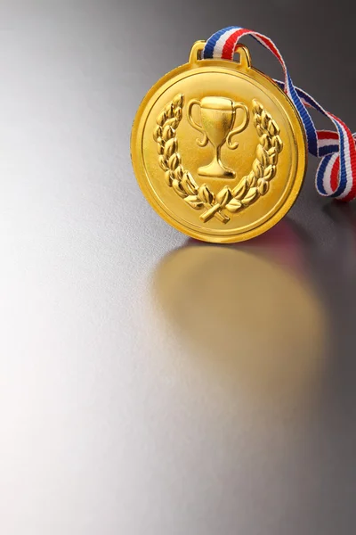 Golden medal with trophy — Stock Photo, Image