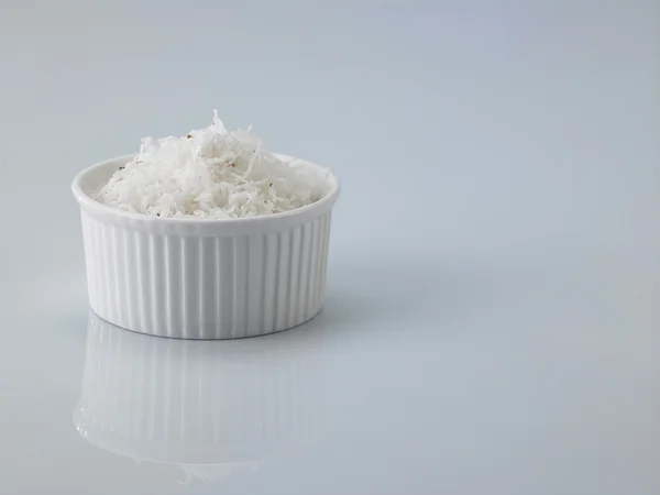 White bowl with shredded coconut — Stock Photo, Image