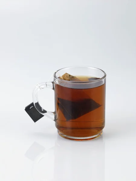 Copa de té con bolsita de té —  Fotos de Stock