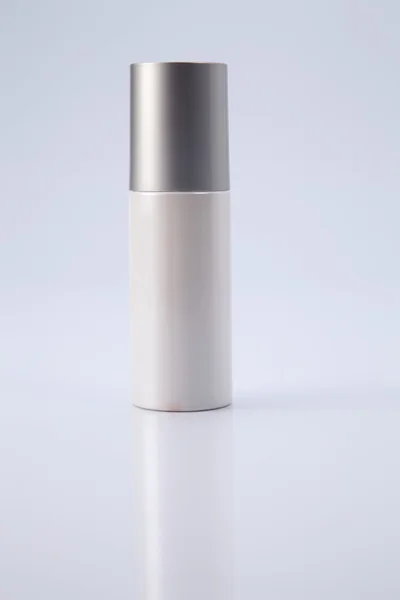 Cosmetic bottle with silver cap — Stock Photo, Image