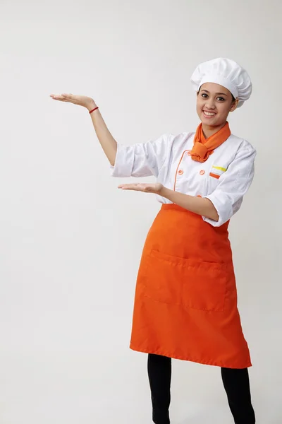 Giovane donna aggraziata vestita da cuoca — Foto Stock