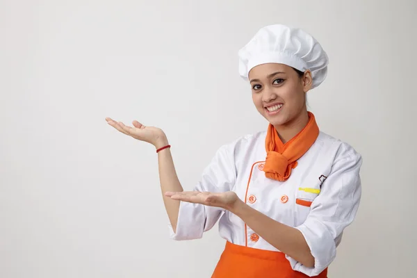 Mladá půvabná žena, oblečená jako kuchař — Stock fotografie