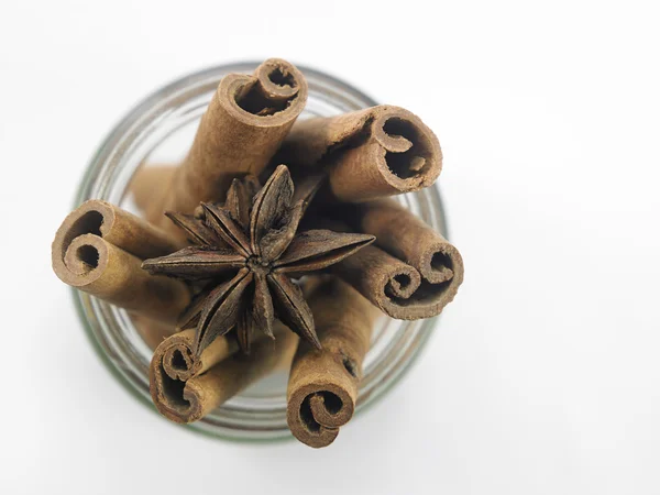 Cinnamon and anise on white — Stock Photo, Image