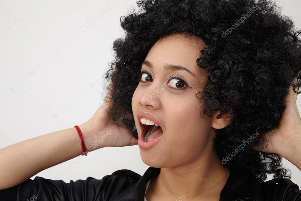 Girl wearing huge afro wig