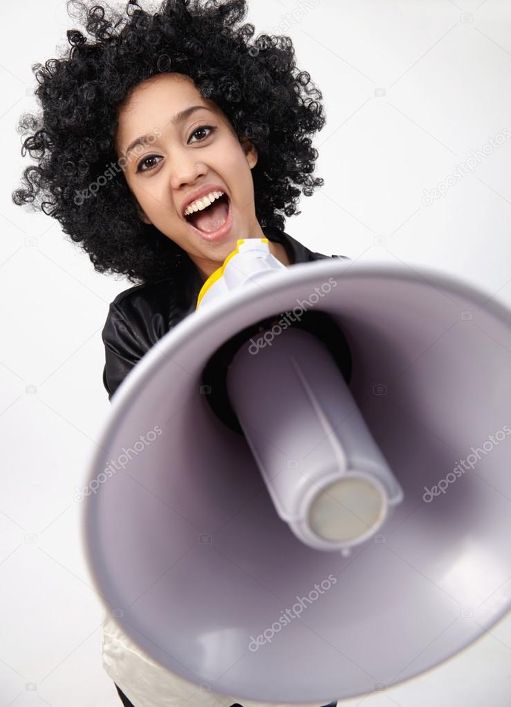 Indian girl in wig and with megaphone