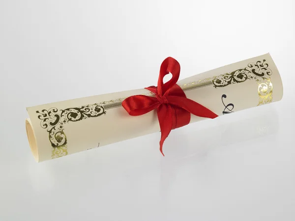 Diploma with red ribbon — Stock Photo, Image