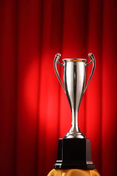 Trophy in front of the red curtain — Stock Photo, Image