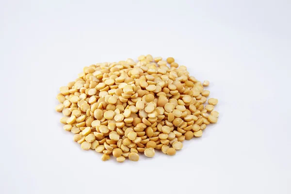 Uncooked yellow lentils — Stock Photo, Image