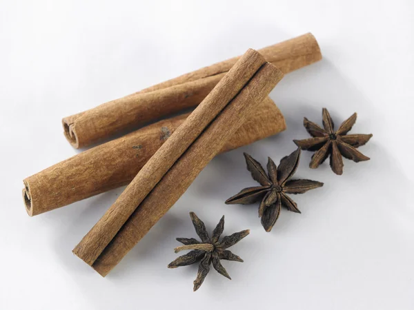 Cinnamon and anise on white — Stock Photo, Image