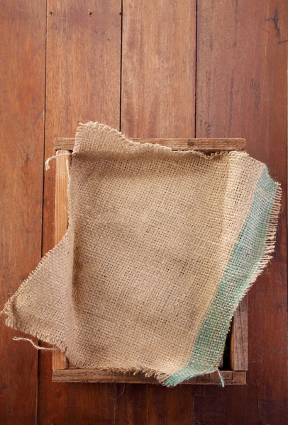Sack cloth on crate — Stock Photo, Image