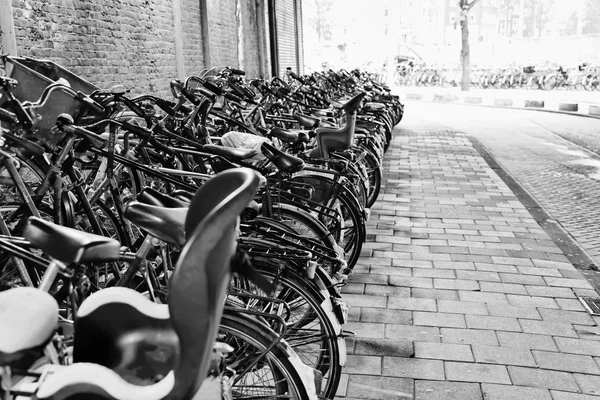 Holland, Amsterdam; 9 October 2011, bicycles parking in a tunnel near the Central Station - EDITORIAL — Stock Photo, Image