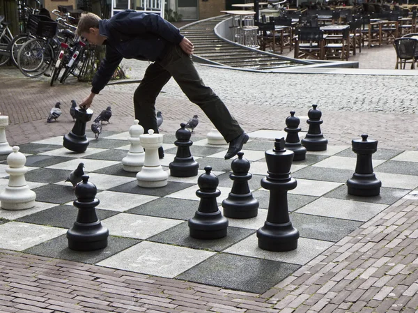 Holland, Amsterdam; 10 October 2011, man playing chess in a central street - EDITORIAL — Stock Photo, Image