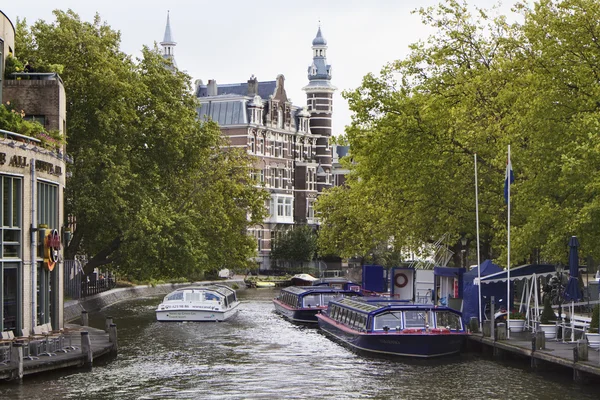 Holland, Amsterdam; 10 October 2011, ferryboats in a water canal - EDITORIAL — Stock Photo, Image