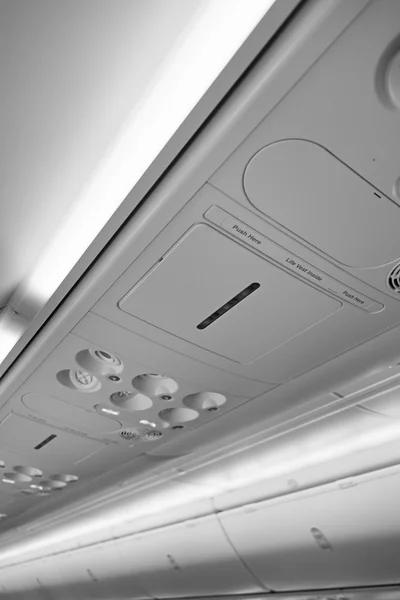 Italy, airplane cabin with no smoking sign on — Stock Photo, Image