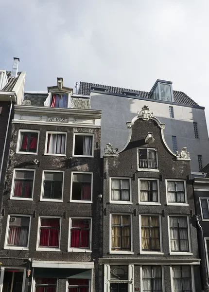 Holland, Amsterdam, the facade of old stone houses — Stock Photo, Image