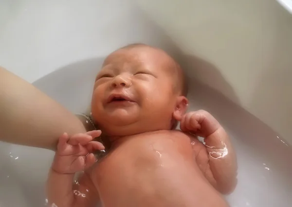 Newborn first bath — Stock Photo, Image