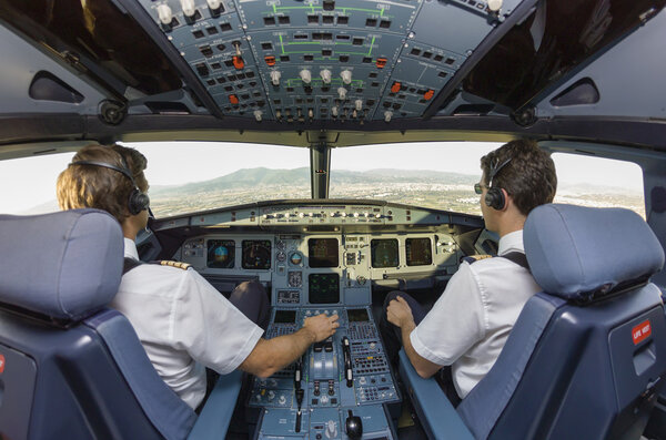 Pilots in an airplane cockpit