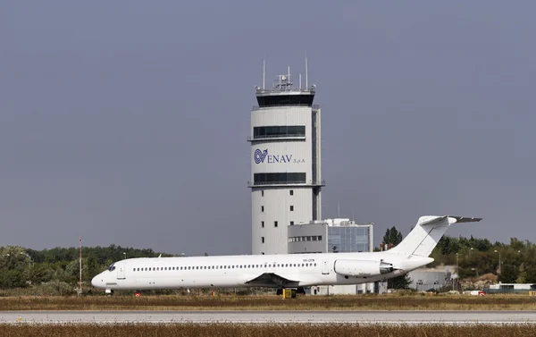 Italy, Venice; 14 September 2011, an airplane on the takeoff runway and the flight control tower - EDITORIAL — Stock Photo, Image