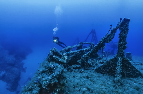 Italy, Mediterranean Sea, diver and a sunken ship wreck - FILM SCAN