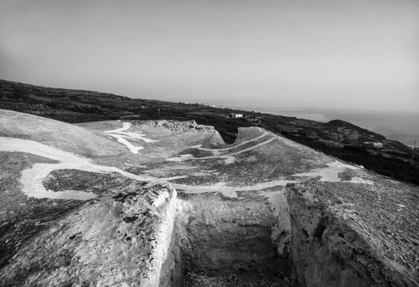 Italy, Sicily, Pantelleria Island (Trapani Province), the roof of a typical stone house (dammuso) and the rocky volanic coastline of the island - FILM SCAN — Stock Photo, Image