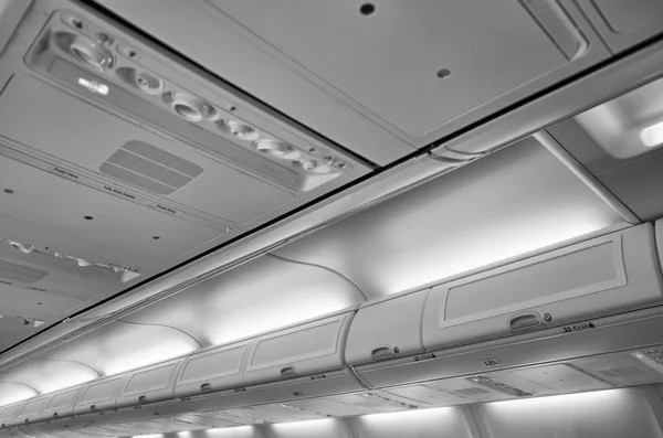 Italy, airplane cabin with the no smoking signs on — Stock Photo, Image