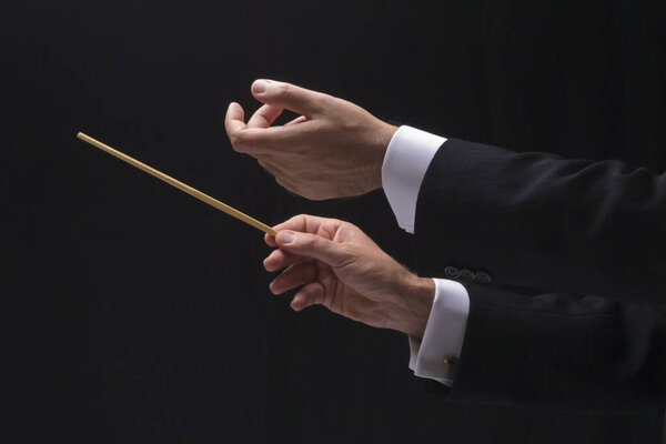 The hands of a music conductor