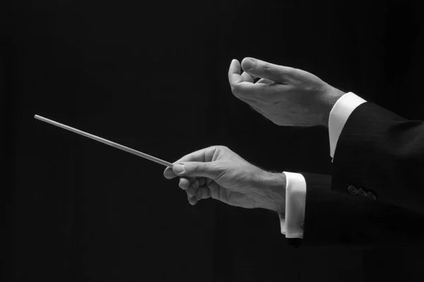 The hands of a music conductor