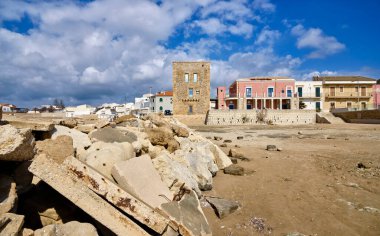 Italy, Sicily, Mediterranean sea, Punta Secca (Ragusa Province), view of a restructured old tower and baroque buildings on the seafront clipart
