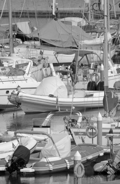 Italy, Sicily, Mediterranean sea, Marina di Ragusa (Ragusa Province); 13 July 2021, people, motor boats and luxury yachts in the port - EDITORIAL
