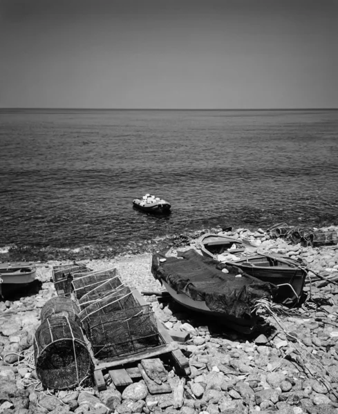 Wooden fishing boats and fish traps ashore