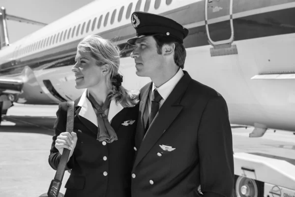 Flight assistants near an airplane — Stock Photo, Image