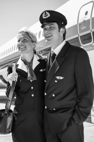 Flight assistants near an airplane — Stock Photo, Image