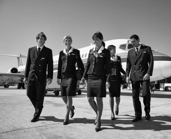 Flight assistants near an airplane — Stock Photo, Image