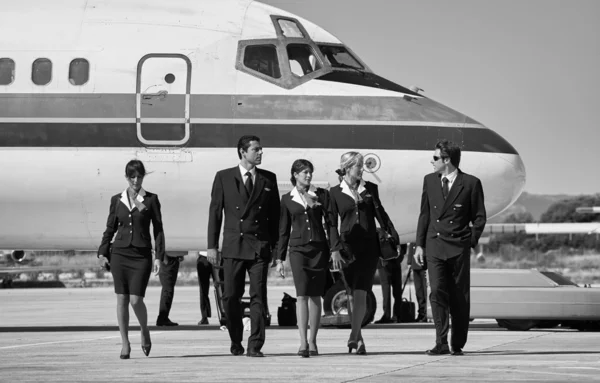 Flight assistants near an airplane — Stock Photo, Image