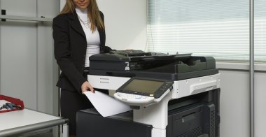 Girl using Xerox machine clipart
