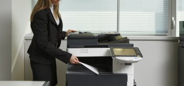 Girl using Xerox machine clipart