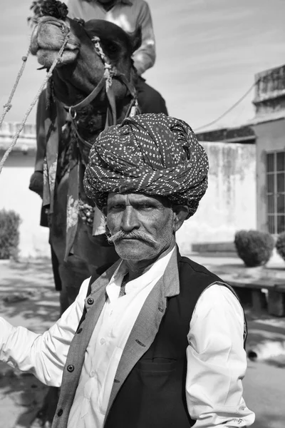 Indian man with his camel at the Amber Palace — Stock Photo, Image