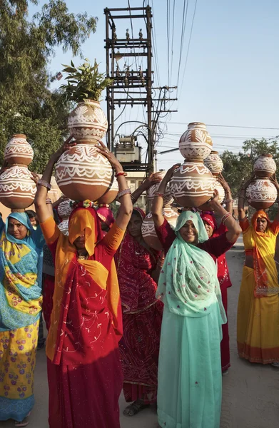 Indian women taking food to a wedding — Stock Photo, Image