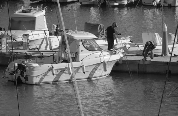 Italy, Sicily, Mediterranean Sea, Marina di Ragusa (Ragusa Province); 13 November 2025, sport fishermen on a motor boat in the port - EDITORIAL