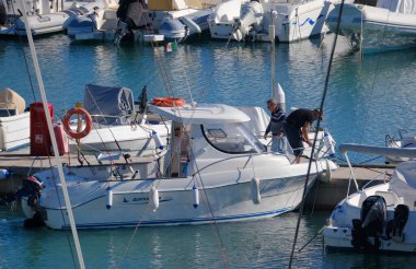 Italy, Sicily, Mediterranean Sea, Marina di Ragusa (Ragusa Province); 13 November 2025, sport fishermen on a motor boat in the port - EDITORIAL