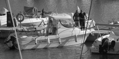 Italy, Sicily, Mediterranean Sea, Marina di Ragusa (Ragusa Province); 13 November 2025, sport fishermen on a motor boat in the port - EDITORIAL