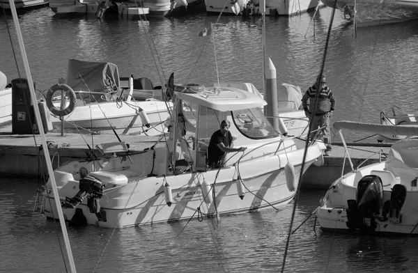 Italy, Sicily, Mediterranean Sea, Marina di Ragusa (Ragusa Province); 13 November 2025, sport fishermen on a motor boat in the port - EDITORIAL