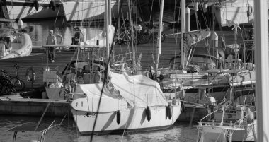 Italy, Sicily, Mediterranean sea, Marina di Ragusa (Ragusa Province); 21 November 2025, woman and luxury yachts in the port - EDITORIAL