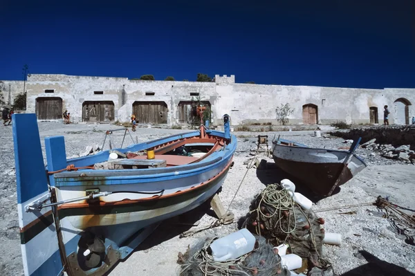 Italy, Sicily, San Vito Lo Capo (Trapani Province), wooden fishing boats at the old tuna fishing factory - FILM SCAN — Stock Photo, Image